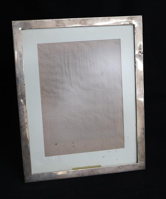 A 1920s silver mounted rectangular photograph frame, by William Neale & Son Ltd, Birmingham, 1925, 34.7cm.